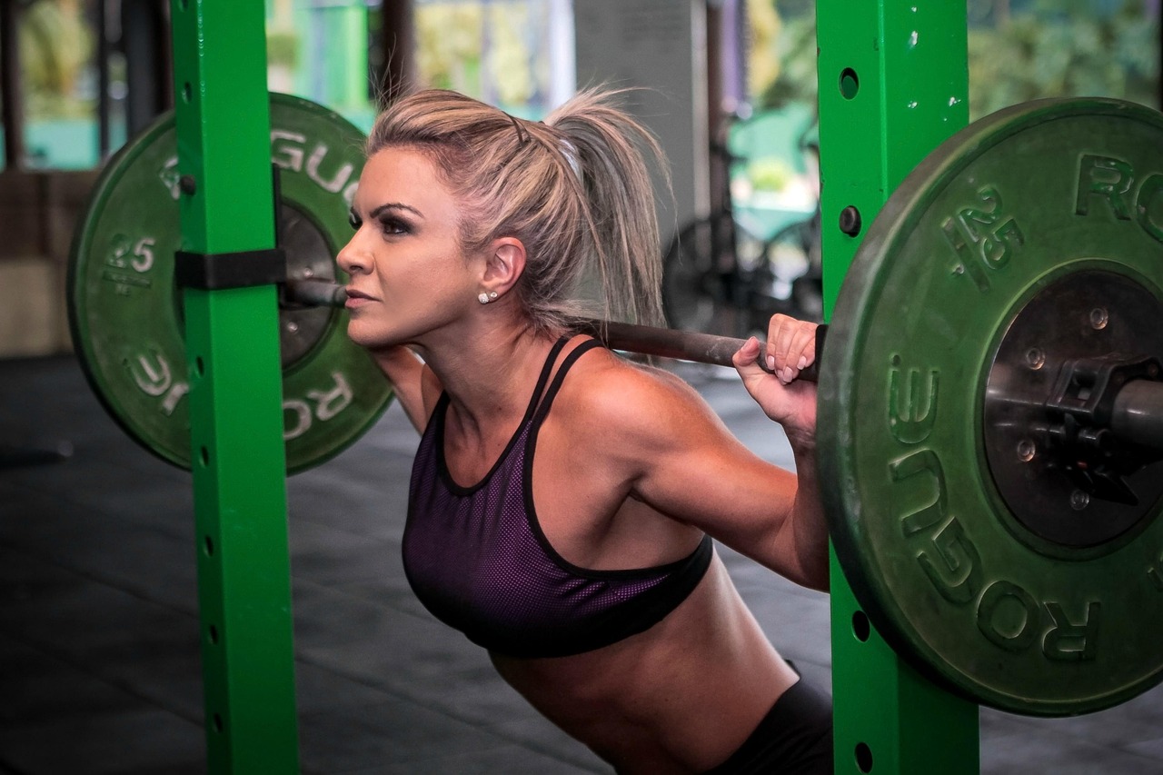 Loaded barbell on a squat rack